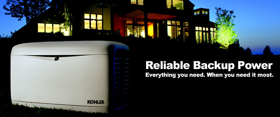 Kohler Generator sitting in front of a well lit house.